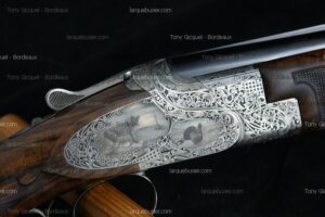 Fusil de chasse de luxe avec gravures détaillées : un léopard et un dindon, motifs floraux. Marques Tony Gicquel - Bordeaux, larquebusier.com.