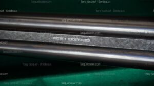 Canons de fusil métalliques polis, avec bande texturée et plaque gravée "- G. GRANGER -" au centre.