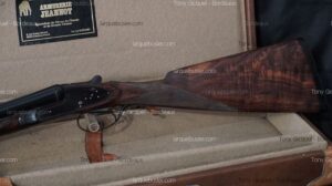 Fusil de chasse double canons Armurerie Jeannot, crosse en bois figuré, dans sa mallette. Spécialiste Chasse Bordeaux.